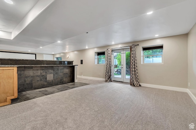 1498 W Mule Train Dr, Bluffdale, UT 84065 - unfurnished living room featuring carpet, baseboards, bar area, recessed lighting, and french doors