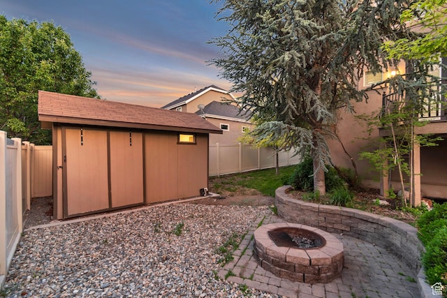 1498 W Mule Train Dr, Bluffdale, UT 84065 - fenced backyard featuring an outdoor fire pit and a patio area