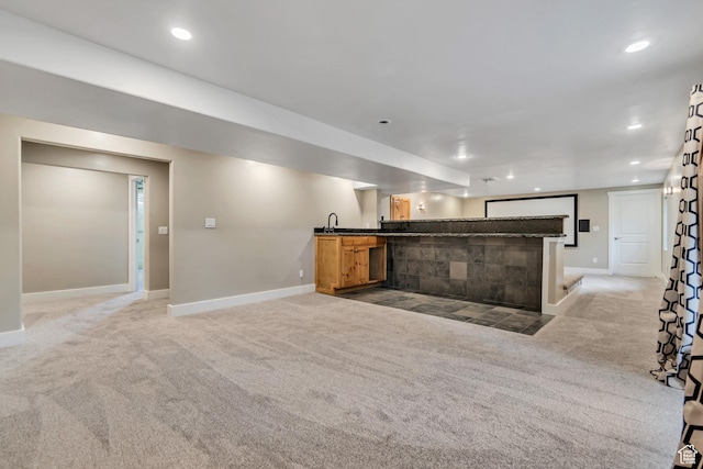 1498 W Mule Train Dr, Bluffdale, UT 84065 - unfurnished living room with light carpet, bar with sink, baseboards, and recessed lighting