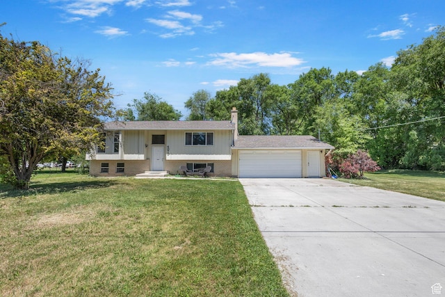 4070 W 2600 N, Corinne, UT 84307 - bi-level home with an attached garage, a front yard, driveway, and brick siding
