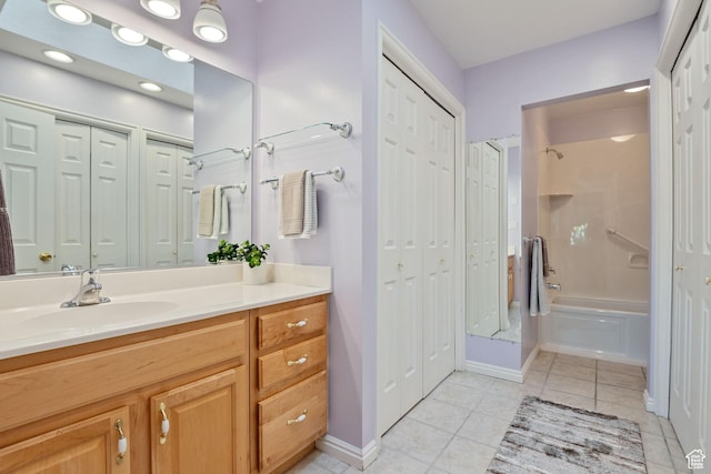 1047 E Eastgate Rd, Salt Lake City, UT 84117 - full bathroom with a closet, vanity, tile patterned floors, and washtub / shower combination