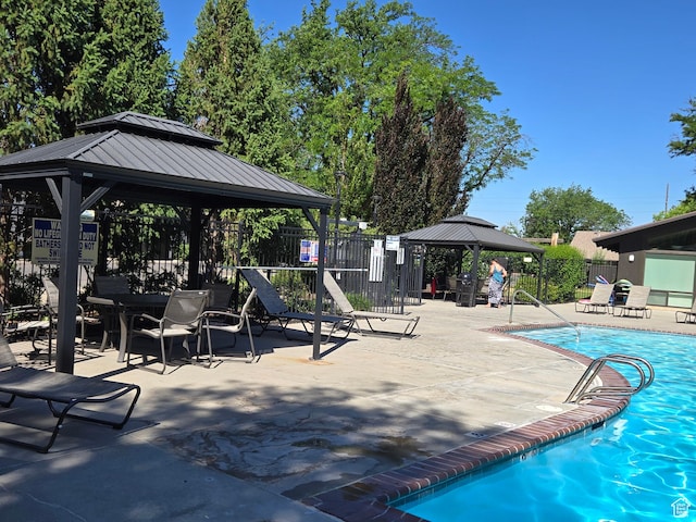 1047 E Eastgate Rd, Salt Lake City, UT 84117 - community pool featuring a gazebo and a patio