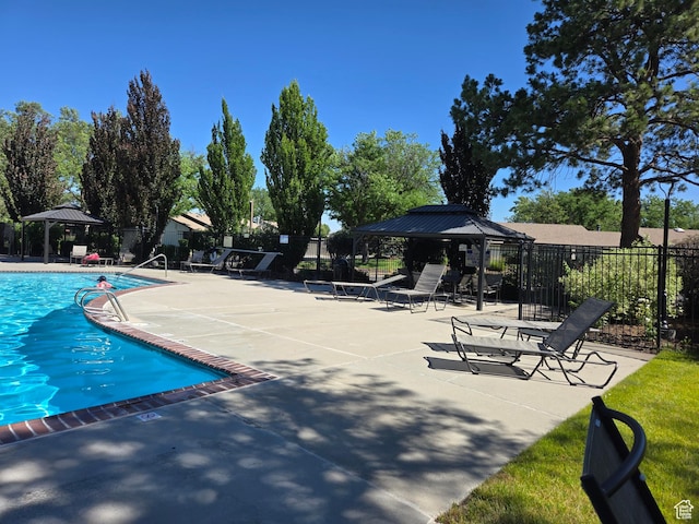 1047 E Eastgate Rd, Salt Lake City, UT 84117 - community pool featuring a gazebo and a patio