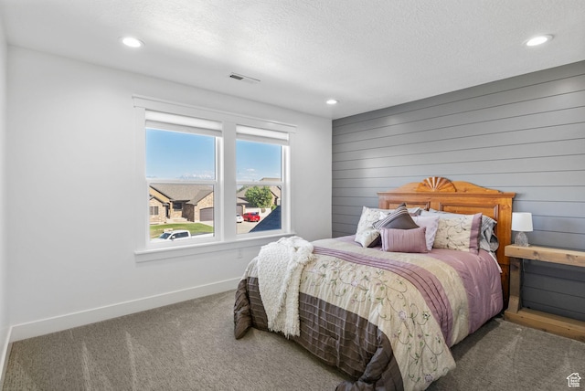 12612 S Starlite Hill Ln W, Herriman, UT 84096 - bedroom with carpet flooring, baseboards, recessed lighting, a textured ceiling, and wooden walls