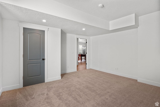 12612 S Starlite Hill Ln W, Herriman, UT 84096 - basement featuring a textured ceiling, carpet flooring, baseboards, and recessed lighting
