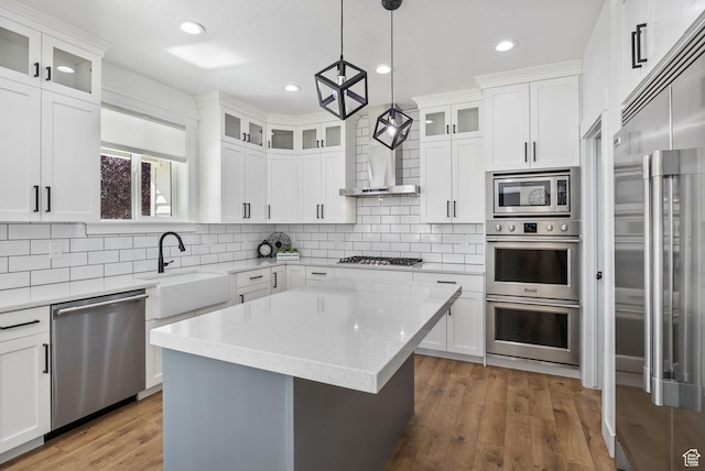 12612 S Starlite Hill Ln W, Herriman, UT 84096 - kitchen featuring appliances with stainless steel finishes, a sink, decorative backsplash, light wood-style floors, and recessed lighting