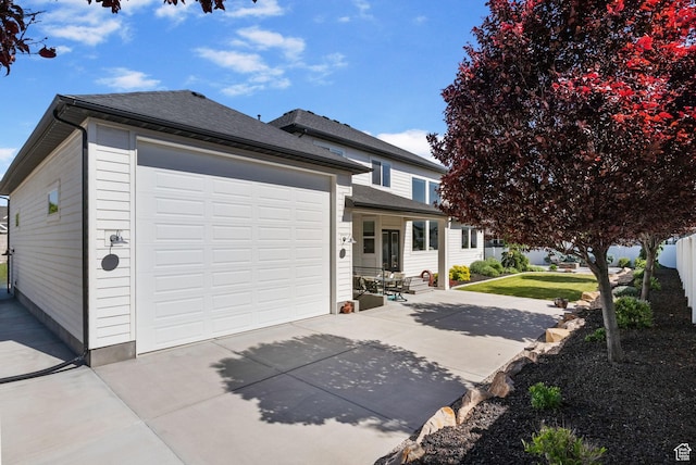 12612 S Starlite Hill Ln W, Herriman, UT 84096 - view of front facade featuring driveway, a shingled roof, and a garage
