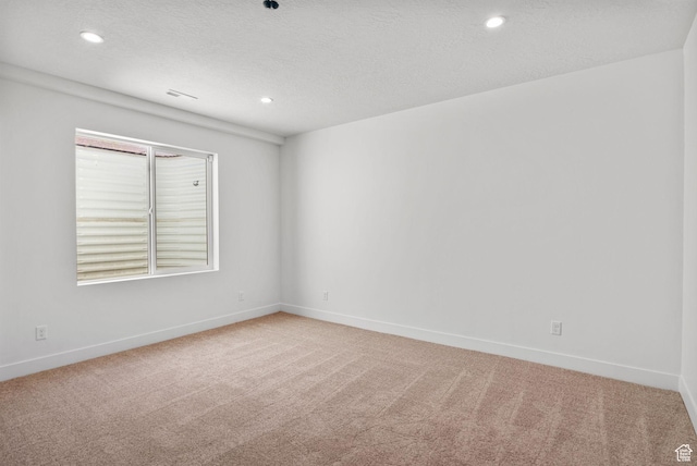 12612 S Starlite Hill Ln W, Herriman, UT 84096 - spare room featuring light carpet, recessed lighting, baseboards, and a textured ceiling