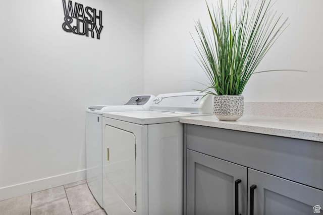 12612 S Starlite Hill Ln W, Herriman, UT 84096 - laundry area with washing machine and dryer, baseboards, light tile patterned floors, and cabinet space