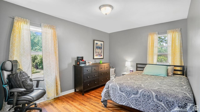 3711 Eccles E, Ogden, UT 84403 - bedroom featuring wood finished floors and baseboards