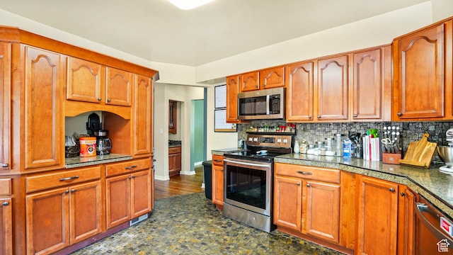 3711 Eccles E, Ogden, UT 84403 - kitchen with appliances with stainless steel finishes, tasteful backsplash, and brown cabinets