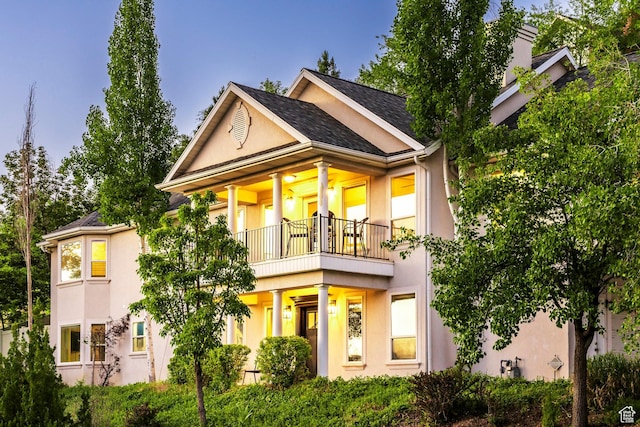 1559 E Oak Cliff Dr N, Provo, UT 84604 - back of house with a balcony, stucco siding, and roof with shingles