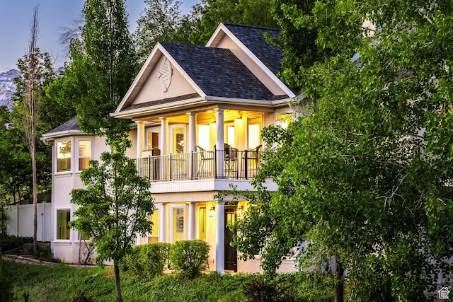 1559 E Oak Cliff Dr N, Provo, UT 84604 - view of front of house with a balcony, stucco siding, and a shingled roof