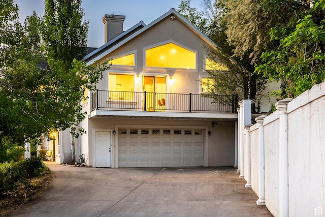 1559 E Oak Cliff Dr N, Provo, UT 84604 - view of front of property with a balcony, driveway, and stucco siding
