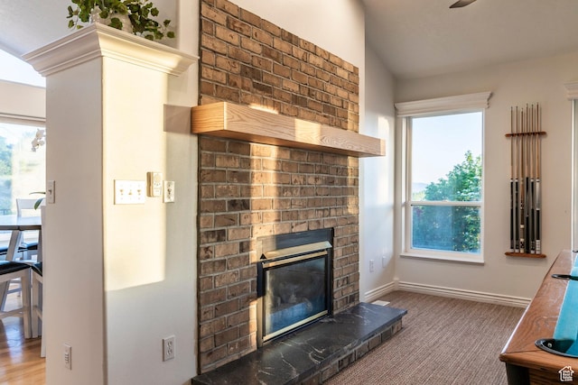 1559 E Oak Cliff Dr N, Provo, UT 84604 - carpeted living room featuring a brick fireplace, healthy amount of natural light, and baseboards