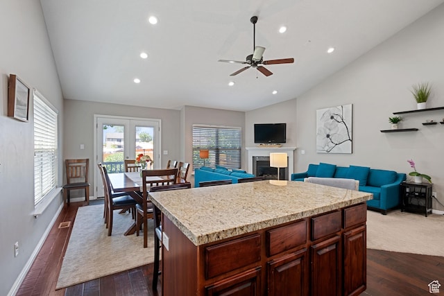 128 W 8600 S, Midvale, UT 84047 - kitchen with lofted ceiling, a ceiling fan, dark wood-style flooring, recessed lighting, and a fireplace