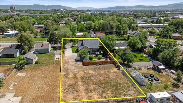 128 W 8600 S, Midvale, UT 84047 - aerial view of residential area featuring mountains and property parcel outlined