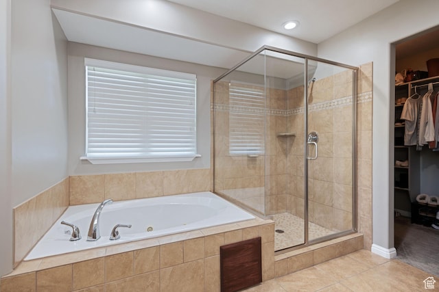 128 W 8600 S, Midvale, UT 84047 - full bath with a whirlpool tub, a stall shower, a walk in closet, and tile patterned flooring