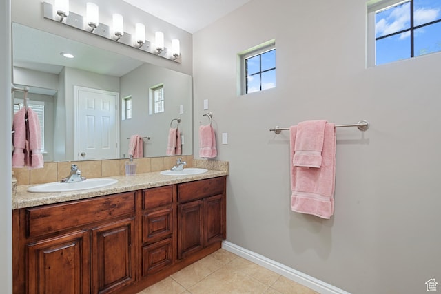 128 W 8600 S, Midvale, UT 84047 - full bath featuring double vanity, baseboards, and tile patterned flooring