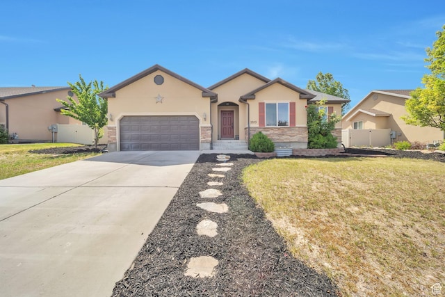 3353 S Red Shouldered Trl, Saratoga Springs, UT 84045 - ranch-style house featuring stucco siding, an attached garage, concrete driveway, and stone siding