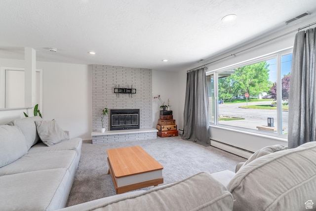 983 Westwood Dr, Pleasant View, UT 84414 - carpeted living room featuring a baseboard radiator, a fireplace, recessed lighting, and a textured ceiling