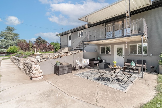 983 Westwood Dr, Pleasant View, UT 84414 - view of patio featuring an outdoor hangout area, a balcony, and stairway