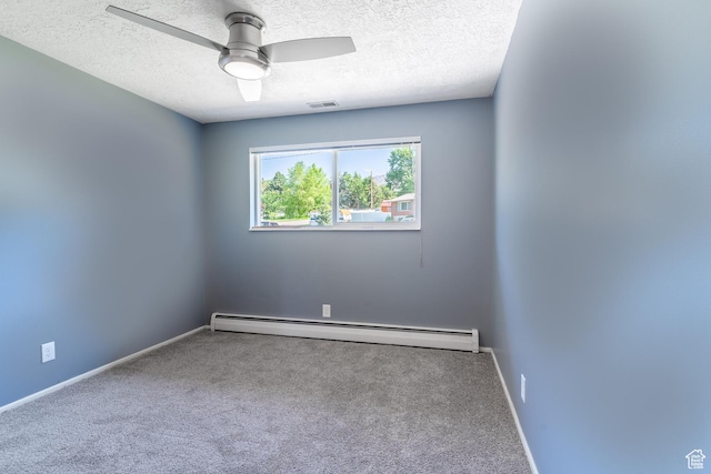983 Westwood Dr, Pleasant View, UT 84414 - spare room featuring baseboard heating, carpet flooring, a textured ceiling, a ceiling fan, and baseboards