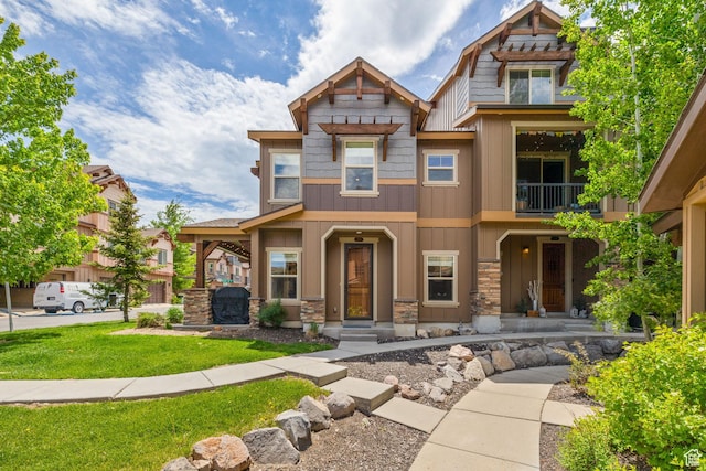760 W Holliday Dr, Kamas, UT 84036 - craftsman inspired home featuring a balcony, stone siding, board and batten siding, and a front lawn