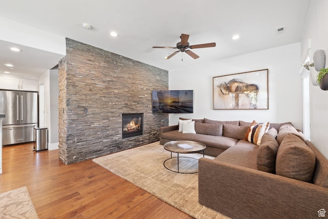760 W Holliday Dr, Kamas, UT 84036 - living area featuring light wood finished floors, ceiling fan, a fireplace, and recessed lighting