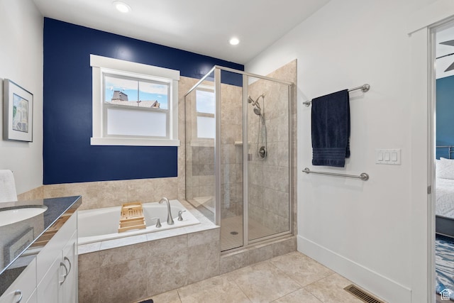 760 W Holliday Dr, Kamas, UT 84036 - bathroom with a garden tub, tile patterned floors, a stall shower, vanity, and recessed lighting