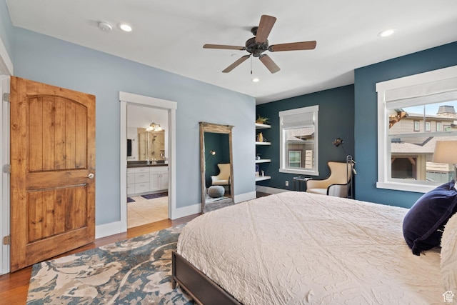 760 W Holliday Dr, Kamas, UT 84036 - bedroom with dark wood finished floors, ensuite bathroom, ceiling fan, baseboards, and recessed lighting
