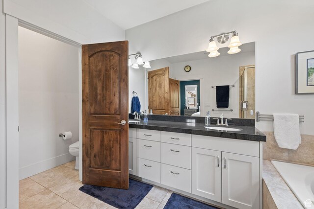 760 W Holliday Dr, Kamas, UT 84036 - full bathroom featuring vanity, a garden tub, tile patterned floors, a stall shower, and toilet