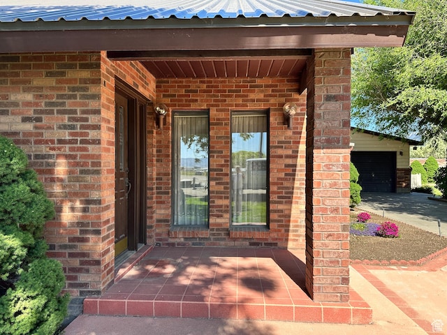 102 S 1000 W, Tremonton, UT 84337 - doorway to property featuring brick siding and metal roof