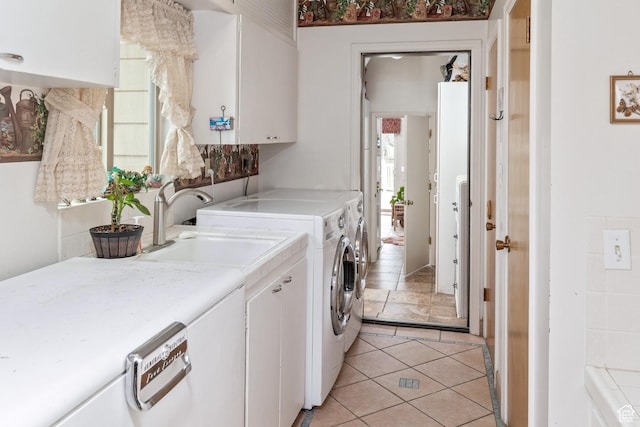 102 S 1000 W, Tremonton, UT 84337 - laundry room with washing machine and clothes dryer, cabinet space, and light tile patterned floors