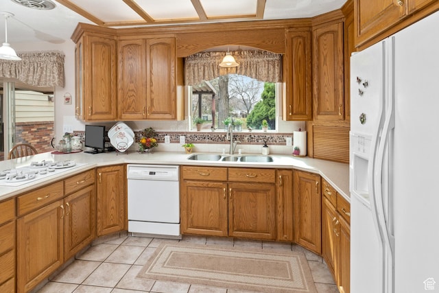 102 S 1000 W, Tremonton, UT 84337 - kitchen featuring white appliances, a sink, and brown cabinets