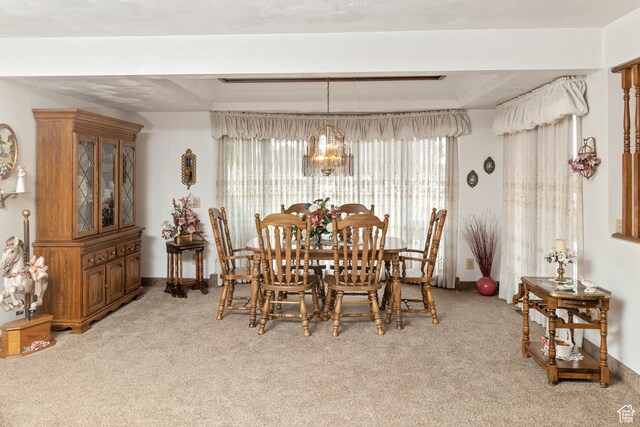 102 S 1000 W, Tremonton, UT 84337 - dining area featuring healthy amount of natural light, light colored carpet, and a chandelier