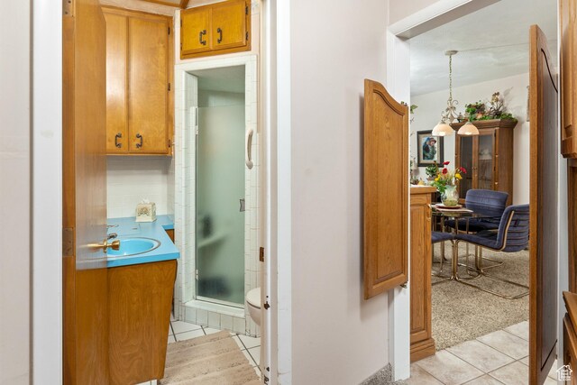 102 S 1000 W, Tremonton, UT 84337 - corridor featuring a sink and light tile patterned flooring