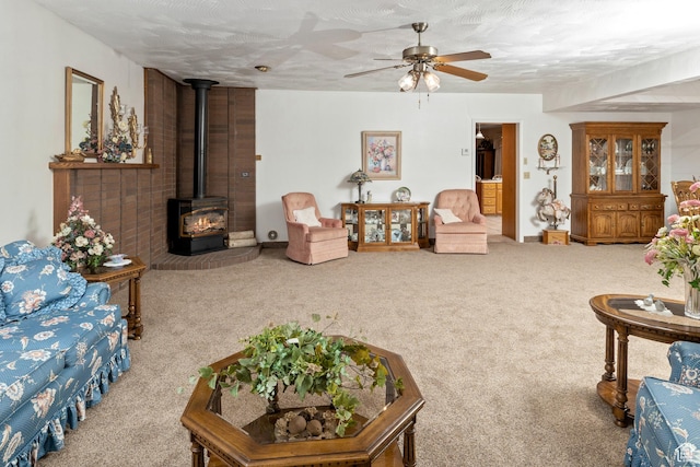 102 S 1000 W, Tremonton, UT 84337 - carpeted living room featuring a wood stove and ceiling fan