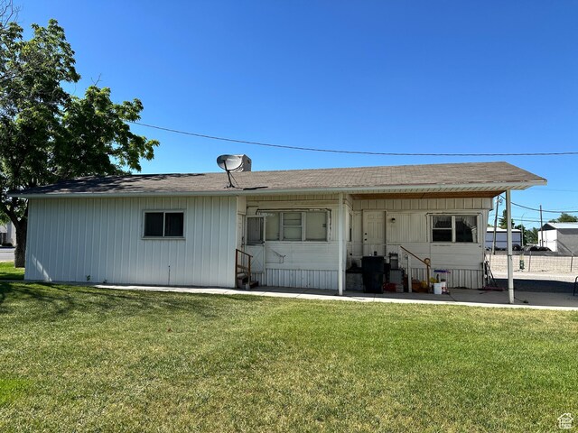 102 S 1000 W, Tremonton, UT 84337 - rear view of property featuring entry steps and a yard