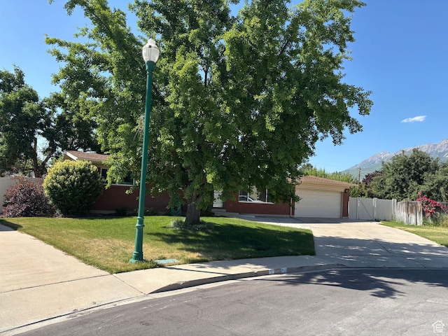 230 S 700 E, Orem, UT 84097 - obstructed view of property with driveway, a garage, and a mountain view