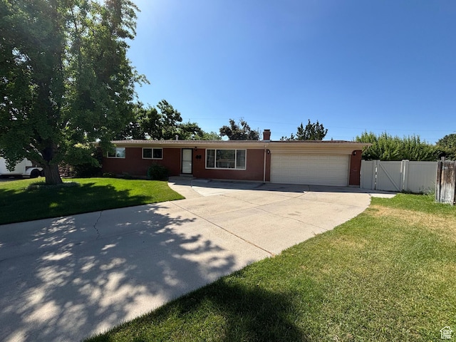 230 S 700 E, Orem, UT 84097 - single story home featuring concrete driveway, an attached garage, a gate, and a chimney
