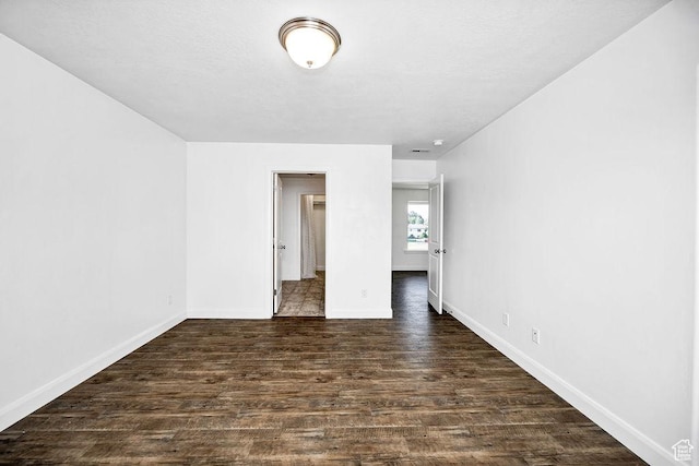 763 W 1060 S, Logan, UT 84321 - spare room featuring dark wood-type flooring and baseboards