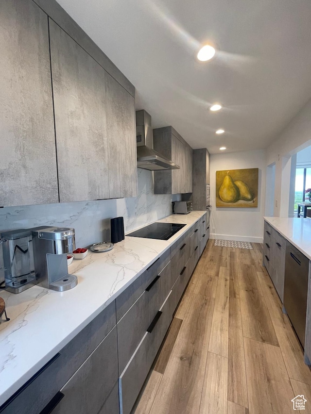 3599 E Oakview Dr, Millcreek, UT 84124 - kitchen with wall chimney exhaust hood, black electric stovetop, modern cabinets, and light wood-style flooring
