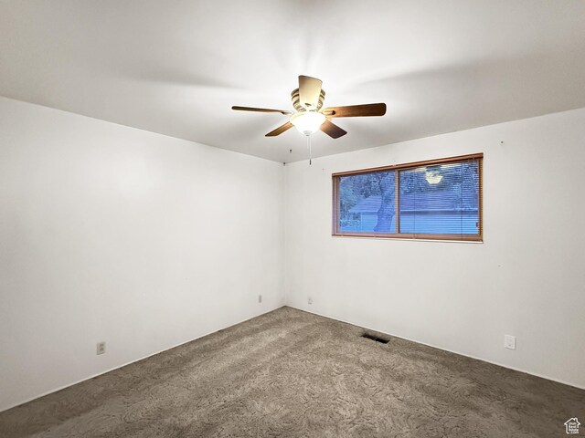 1066 Beecher Ave, Brigham City, UT 84302 - carpeted empty room with a ceiling fan
