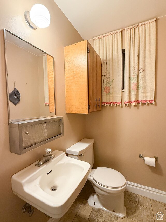 1066 Beecher Ave, Brigham City, UT 84302 - half bath featuring a sink, toilet, baseboards, and tile patterned flooring