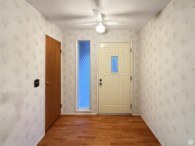 1066 Beecher Ave, Brigham City, UT 84302 - foyer entrance featuring light wood-style floors, ceiling fan, and baseboards
