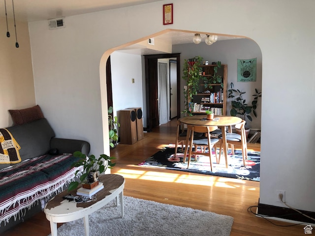 823 E 23rd St S, Ogden, UT 84401 - living room with arched walkways and wood finished floors