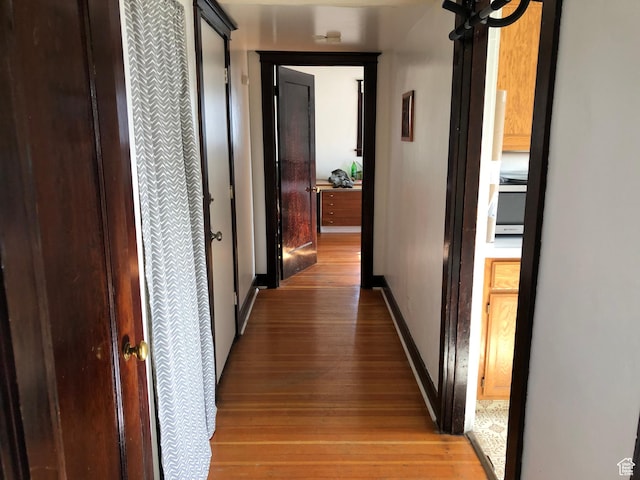 823 E 23rd St S, Ogden, UT 84401 - hall with light wood-type flooring and baseboards