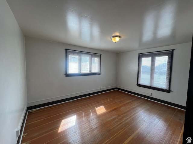 823 E 23rd St S, Ogden, UT 84401 - spare room with hardwood / wood-style flooring, plenty of natural light, and baseboards