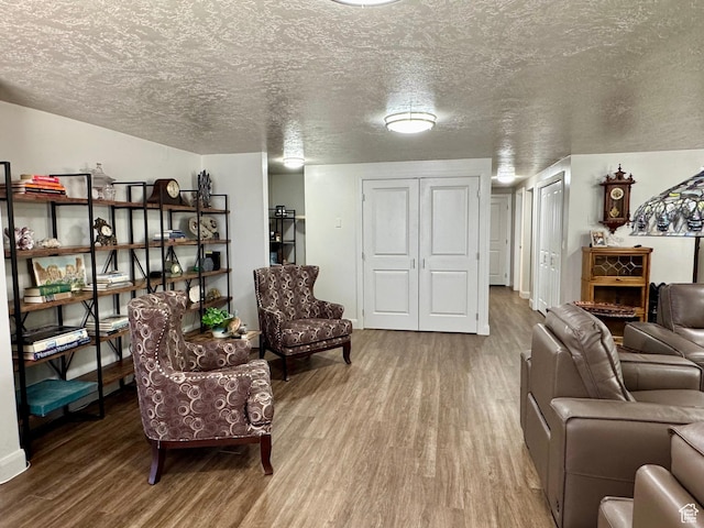 160 W 100 S, Fillmore, UT 84631 - living area featuring wood finished floors, a textured ceiling, and baseboards